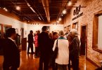 Arts Clayton attendees mingling during event