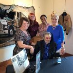 Linda Crissey with staff and Burt Reynolds
